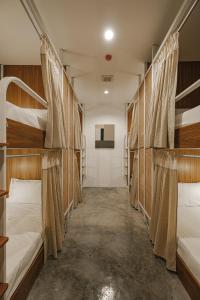 Ein Bett oder Betten in einem Zimmer der Unterkunft Hidden Garden Hostel