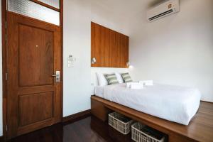 Ein Bett oder Betten in einem Zimmer der Unterkunft Hidden Garden Hostel