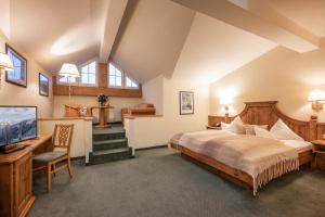 Telewizja i/lub zestaw kina domowego w obiekcie Hotel Sonnschein