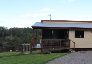 a house with a porch and a balcony at Bellthorpe Stays in Maleny +44 photos