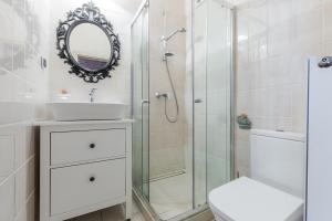 a bathroom with a shower and a sink and a toilet at Morze u Moni in Karwieńskie Błoto Pierwsze +46 photos