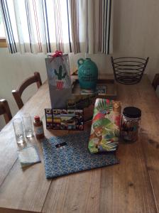 a wooden table with books on top of it at Repelsteeltje op Terschelling in Formerum