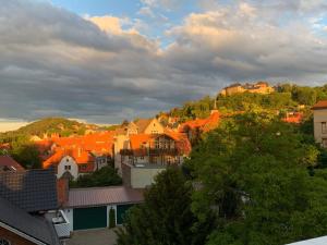 a view of a town with orange roofs at Über den Dächern in Blankenburg