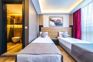 Postel nebo postele na pokoji v ubytování RUSH HOTEL İSTANBUL