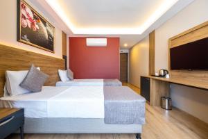 Postel nebo postele na pokoji v ubytování RUSH HOTEL İSTANBUL