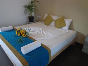 Postel nebo postele na pokoji v ubytování Hotel Star White - Negombo