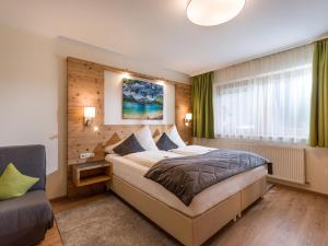 A bed or beds in a room at Appartements Fortuna