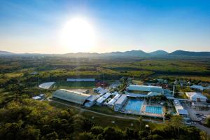 an aerial view of a building with mountains in the background at Thanyapura Sports & Health Resort in Thalang