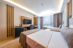 Postel nebo postele na pokoji v ubytování RUSH HOTEL İSTANBUL