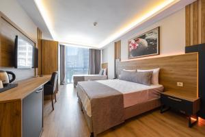 Postel nebo postele na pokoji v ubytování RUSH HOTEL İSTANBUL