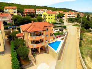 a house with a swimming pool next to a street at La Vista apartments in Salatić