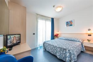 Postel nebo postele na pokoji v ubytování Hotel Minerva