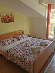 Postel nebo postele na pokoji v ubytování Apartmani "Ivan"