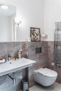 Een badkamer bij Appia Hotel Residences