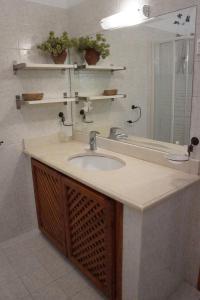 a bathroom with a sink and a mirror at Villa Pefka in Skiathos +23 photos