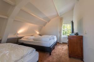En eller flere senger på et rom på Mooiste plekje van Noordwijk