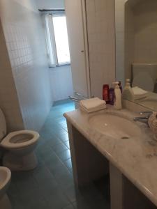 a bathroom with a sink and a toilet and a shower at Camere Francesca in Vernazza