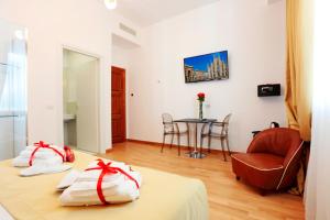Posteľ alebo postele v izbe v ubytovaní HeMi Suites