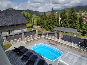 an overhead view of a swimming pool on a house at Cottage Diamant Y&M in Palyanytsya