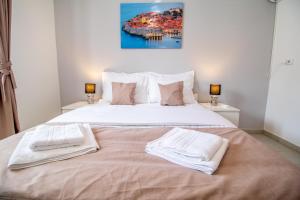 Postel nebo postele na pokoji v ubytování Apartments Vito