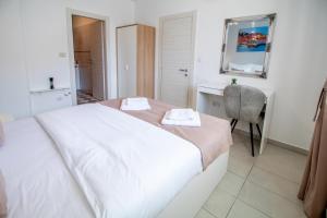 Postel nebo postele na pokoji v ubytování Apartments Vito