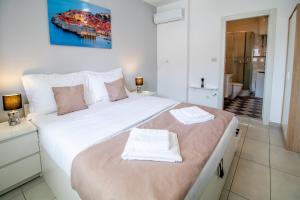 Postel nebo postele na pokoji v ubytování Apartments Vito