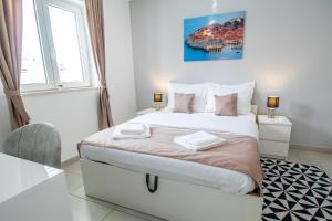 Postel nebo postele na pokoji v ubytování Apartments Vito