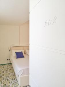 Postel nebo postele na pokoji v ubytování Hotel Villa Felice Relais
