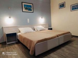Postel nebo postele na pokoji v ubytování Moros Apartments