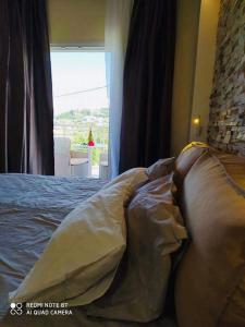 Postel nebo postele na pokoji v ubytování Moros Apartments