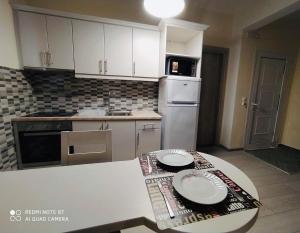 Kuchyň nebo kuchyňský kout v ubytování Moros Apartments