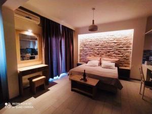 Postel nebo postele na pokoji v ubytování Moros Apartments