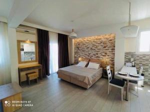 Postel nebo postele na pokoji v ubytování Moros Apartments