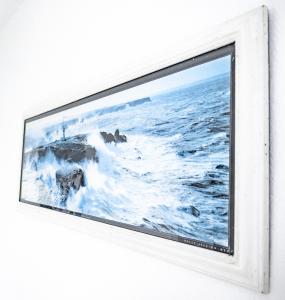 a picture of the ocean on a television screen at Tarifa Watersports Residence in Tarifa