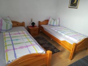 Postel nebo postele na pokoji v ubytování Brauhaus Fröschl