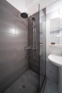 Koupelna v ubytování Hotel Cokkinis + 37 fotografií
