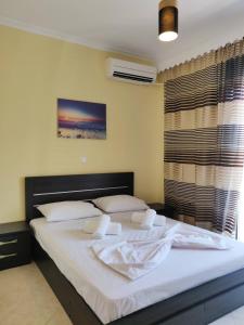 Postel nebo postele na pokoji v ubytování Atrium Luxurious Sea View Apartment