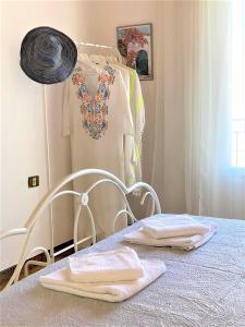 a room with a bed with towels on a table at Summer house in Spetses in Spetses