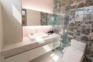 Koupelna v ubytování He-Jia Hotel