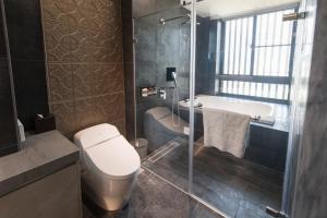 Koupelna v ubytování He-Jia Hotel