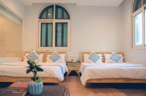 Giường trong phòng chung tại The Costis Phu Quoc - Hostel and Homestay