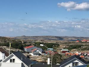 a small town with houses and a body of water at Sommar på Smögen! in Smögen