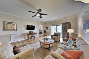 a living room with a couch and a table at Myrtlewood Condos in Myrtle Beach