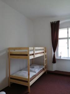 Postel nebo postele na pokoji v ubytování Penzion U Šlechtičen