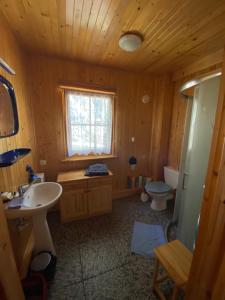 a bathroom with a sink and a toilet at Alga in Mrzeżyno +15 photos