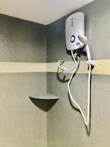 a hair dryer on the corner of a room at Highway Times Inn Hotel in Ipoh