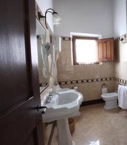 a bathroom with a sink and a toilet at Agriturismo San Gallo in Montepulciano +43 photos