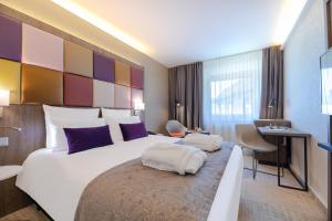 Postel nebo postele na pokoji v ubytování Mercure Budapest Korona
