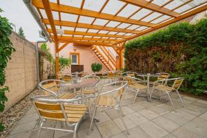 Patio nebo venkovní prostory v ubytování Penzion U Kostela
