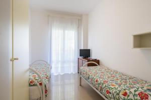 Appartamenti Mare Caorle客房内的一张或多张床位